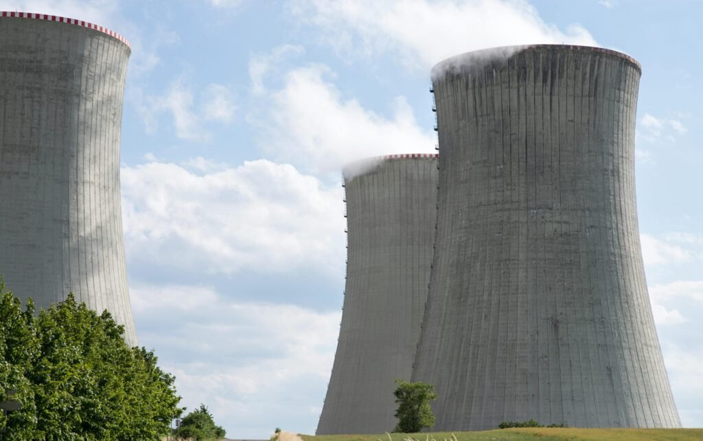 Cooling towers of Dukovany nuclear power plant with steam on a clear day.